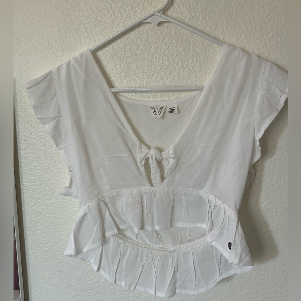 Roxy top, color white, size xs, worn a few times and, has a little stain